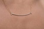 Large diamond smile gold necklace