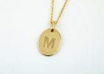 Oval initial gold disk necklace
