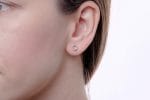 Circle huggie gold earrings - Image 4