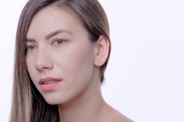 Curved bar gold earrings - Image 4