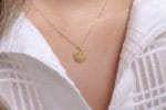 Round gold disc compass necklace