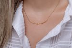 Unique gold knot bar necklace