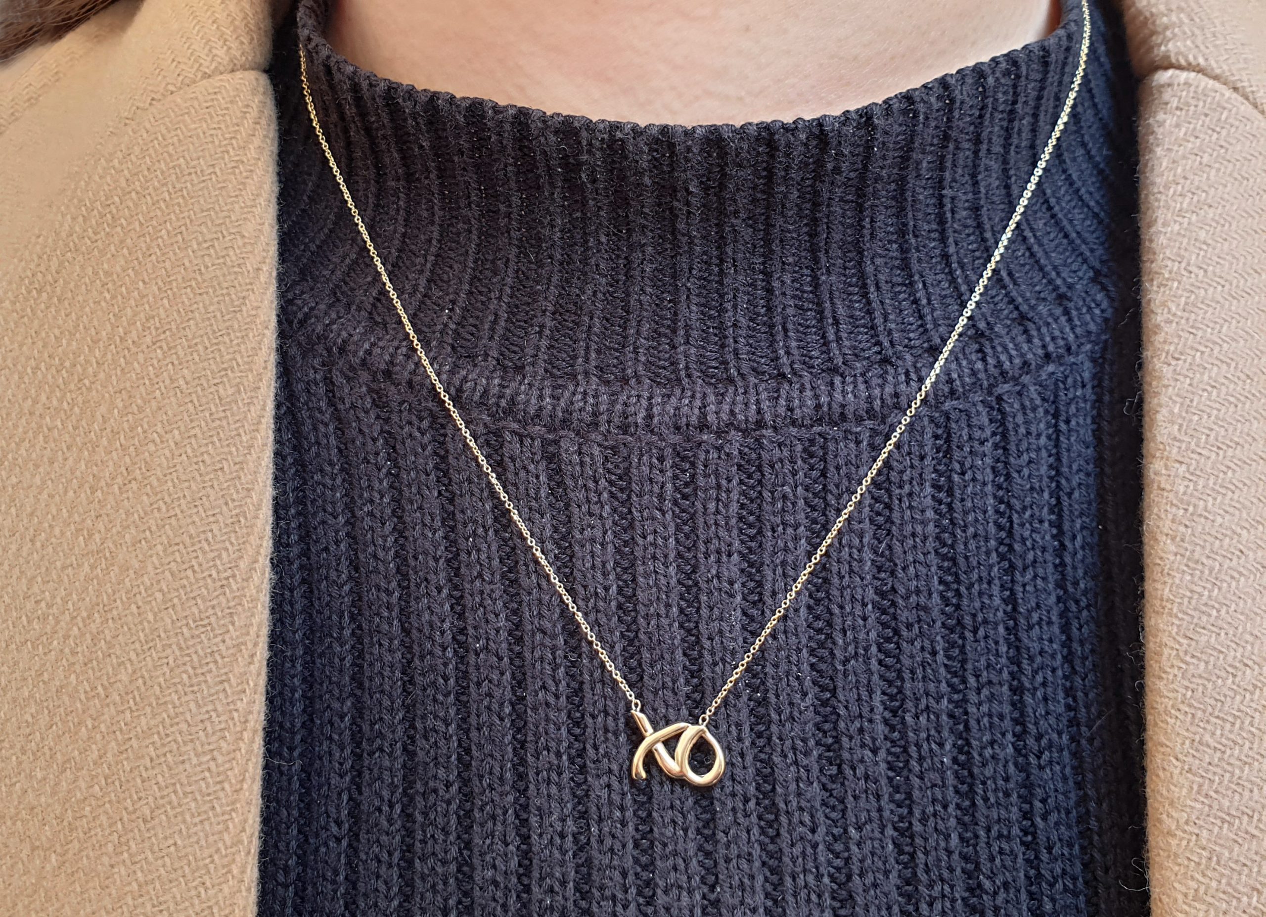 High Polish X and O Draped Necklace in Yellow Gold | Costco