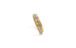 Wedding ring in solid gold with two colors with decorative geometric elements.