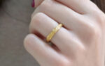 Wedding ring in solid gold with texture.