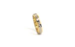 Wedding ring in solid gold with two colors and hammerd the central piece.