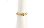 Wedding ring in solid gold with satin finish.